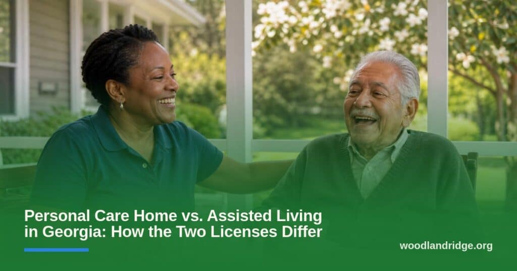 A caregiver and an older man laugh together over tea on a sunny screened porch at an assisted living community.